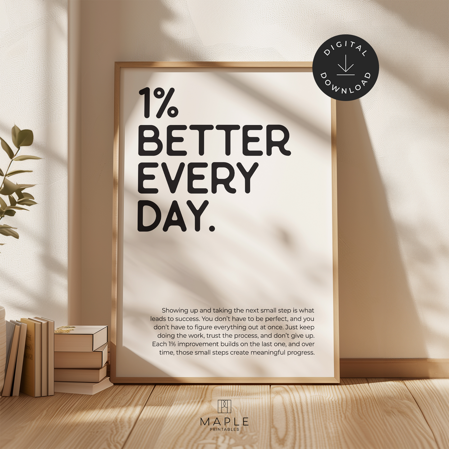 Motivational poster with quote '1% Better Every Day' in black letters on a white background. Minimalist design style. Shown in a wood frame leaning on a wall.