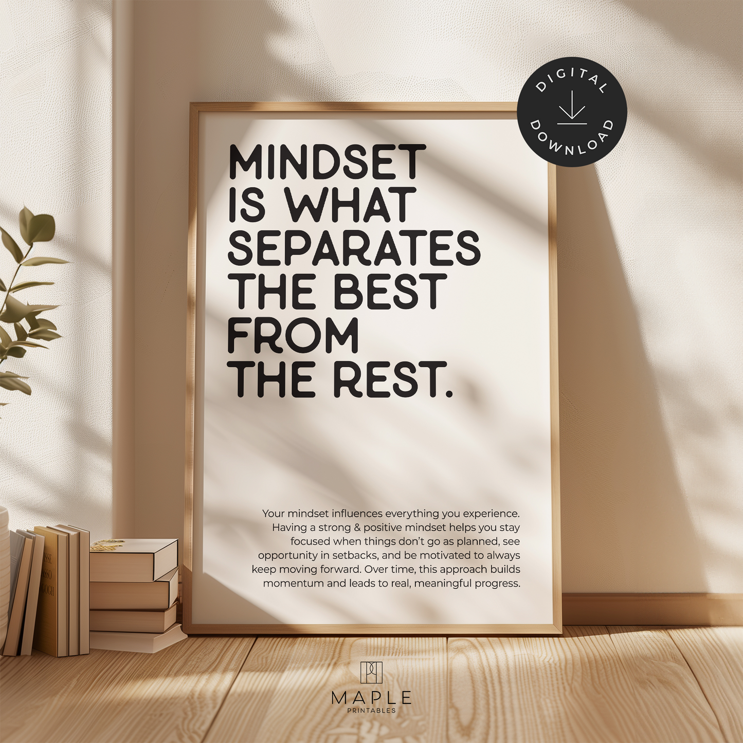 This image shows a framed motivational poster with the large words “Mindset is what separates the best from the rest” in the top left corner, and a longer paragraph at the bottom in a smaller font size. The print features bold black lettering on a clean white background and is displayed in a light wood frame. It’s styled in a warm, neutral space with soft sunlight and a plant nearby. A small circle in the corner says “Digital Download.”