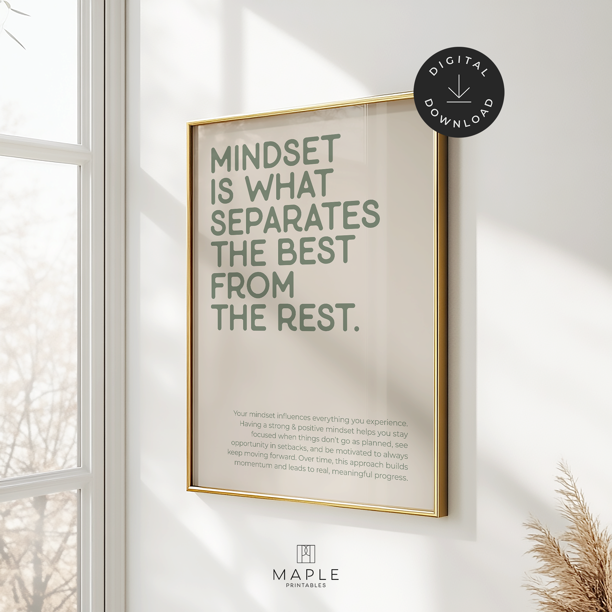 This image shows a hanging framed motivational poster with the large words “Mindset is what separates the best from the rest” in the top left corner, and a longer paragraph at the bottom in a smaller font size. The print features sage green lettering on a beige background and is displayed in a gold frame. It’s styled in a bright space with a window and a plant nearby. A small circle in the corner says “Digital Download.”
